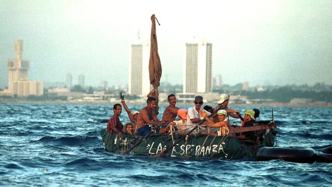 Cubans leave the coast in a raft  in this August 1994 file photo in Havana Cuba during the 1994 massive exodus.