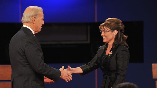 Palin greets Joe Biden on stage for their vice presidential debate on Oct. 2, 2008, at Washington University in St. Louis.