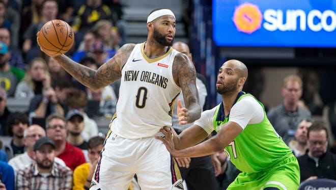 2018: New Orleans Pelicans center DeMarcus Cousins (0) looks to pass the ball over Minnesota Timberwolves forward Taj Gibson (67) in the second half at Target Center.