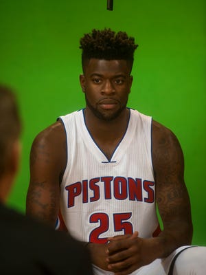 Detroit Pistons wing Reggie Bullock answers questions during media day in Auburn Hills on Sept. 25, 2016.
