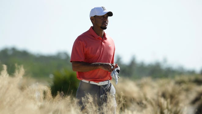 Tiger Woods walks from the seventh tee during the Pro-Am at the Hero World Challenge golf tournament.