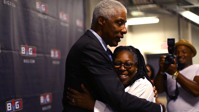 Coach Julius "Dr. J" Erving of Tri-State hugs actress Whoopi Goldberg during week one of the BIG3 three on three basketball league at Barclays Center on June 25, 2017 in New York City.