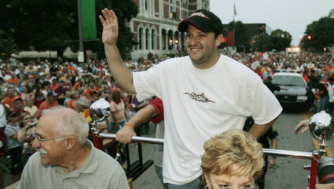 Tony Stewart and his parents ride a fire truck during a celebratory parade through his hometown of Columbus, Ind., after Stewart won the Allstate 400 at the Brickyard in 2005.