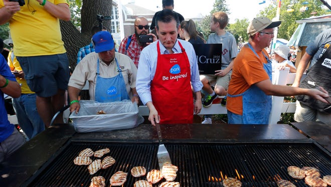 Cruz helps cook pork at the Iowa State Fair on Aug. 21, 2015, in Des Moines.