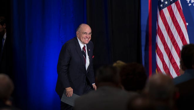 Rudy Guiliani walks on stay to warm up the crowd for GOP presidential nominee Donald Trump at Eisenhower Hotel in Gettysburg just after noon on Saturday, Oct. 22, 2016.