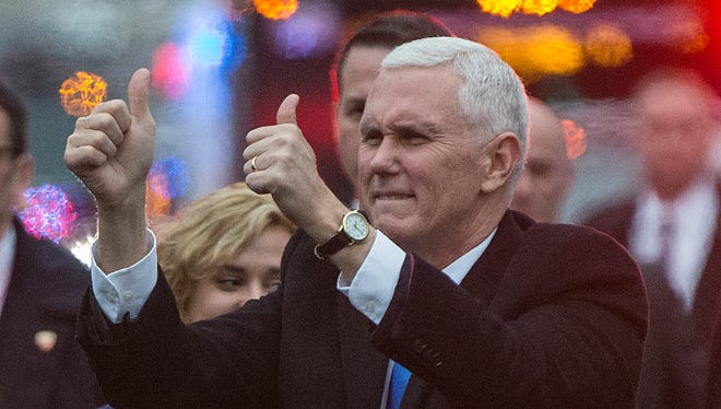 Vice President of the United States Mike Pence gives two thumbs up to the crowds while walking in the Inaugural Parade on Pennsylvania Avenue, Washington D.C., on Jan. 20, 2017.