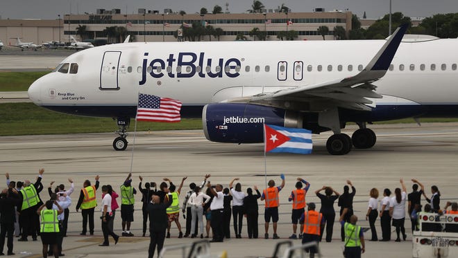 Workers and officials watch as JetBlue Flight 387 prepares for take off as it becomes the first scheduled commercial flight to Cuba since 1961 on Aug. 31, 2016 in Fort Lauderdale, Fla. JetBlue hopes to have as many as 110 daily flights to Cuba is the first U.S. airline to resume regularly scheduled airline service under new rules allowing Americans greater access to Cuba.