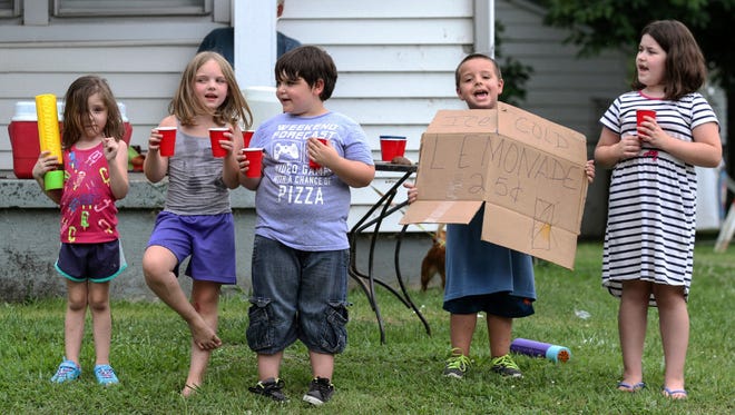 Children sell lemonade on July 19 in Owensboro, Ky.