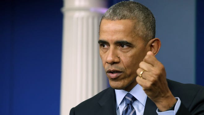 President Obama answers questions during a news conference in the Brady Press Breifing Room at the White House Friday.