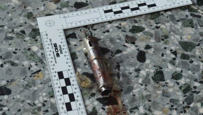This photo obtained May 24, 2017, from The New York Times who got it from British law enforcement, shows what the bomber in the Manchester terrorist attack appeared to have carried as a powerful explosive in a lightweight metal container concealed within a blue Karrimor backpack. He is believed to have held a small detonator in his left hand, according to preliminary information gathered by British authorities.