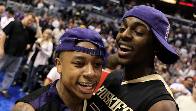 March 13, 2010: Isaiah Thomas and Justin Hoiliday of the Washington Huskies celebrate after a win over the California Golden Bears.