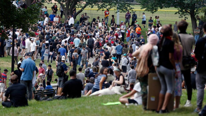 People assemble on Boston Common before a planned free speech rally.