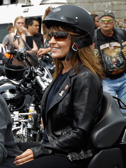 Palin rides on a motorcycle before participating in the Rolling Thunder rally on May 29, 2011, in Arlington, Va.