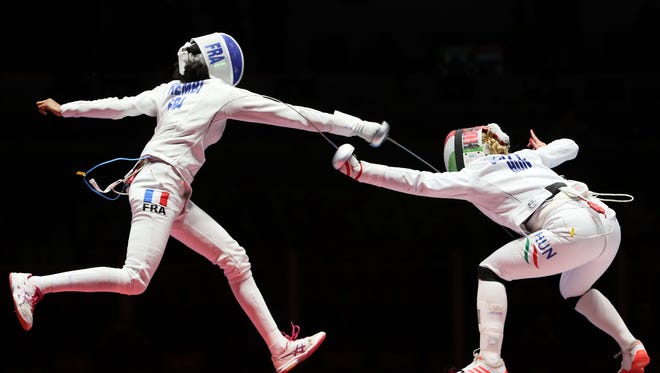 Emese Szasz (HUN) and Lauren Rembi (FRA) compete during the women's epee individual semifinals in the Rio 2016 Summer Olympic Games at Carioca Arena 3.