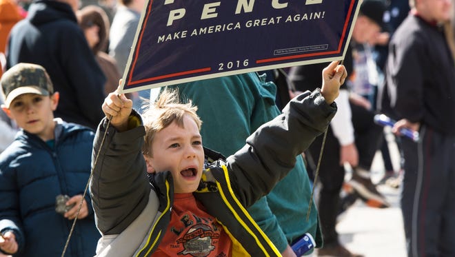 Jacob Robertson, 7, from Hanover, stands outside with his family yelling, "Vote for Trump and Pence," on Saturday, Oct. 22, 2016 at the Eisenhower Complex in Gettysburg, Pa. Trump has a closed campaign event to talk about policy.