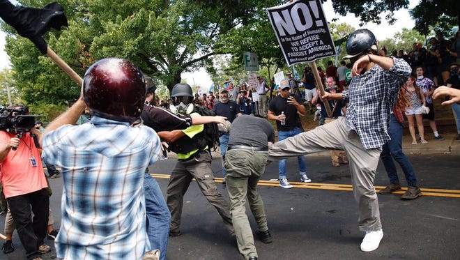 Alt-right groups and anti-fascist counter protesters clash. White nationalists were holding a rally against the removal of a Robert E. Lee statue in Emancipation Park, formerly known as Lee Park. Gov. Terry McAuliffe to declared a state of emergency and the National Guard was put on stand-by. Best available quality.