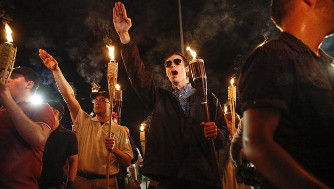 Multiple white nationalist groups march with torches through the UVA campus in Charlottesville. When met by counter protesters, some yelling "Black lives matter," tempers turned into violence. Multiple punches were thrown, pepper spray was sprayed and torches were used as weapons.