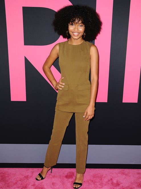 Yara Shahidi looked great in a fitted brown ensemble paired with black heeled sandals and gorgeous hair.