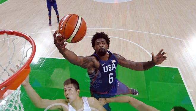 United States center DeAndre Jordan (6) reaches for the ball over China center Yuchen Zou (14) and Muhao Li (13) during the preliminary round of the me's basketball in the Rio2016 Summer Olympic Games at Carioca Arena 1.