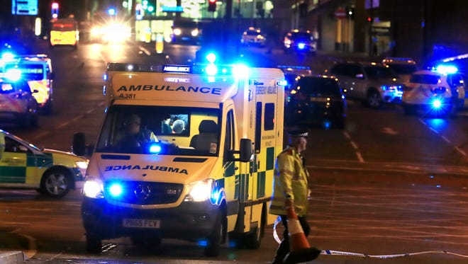 Emergency services work at Manchester Arena.