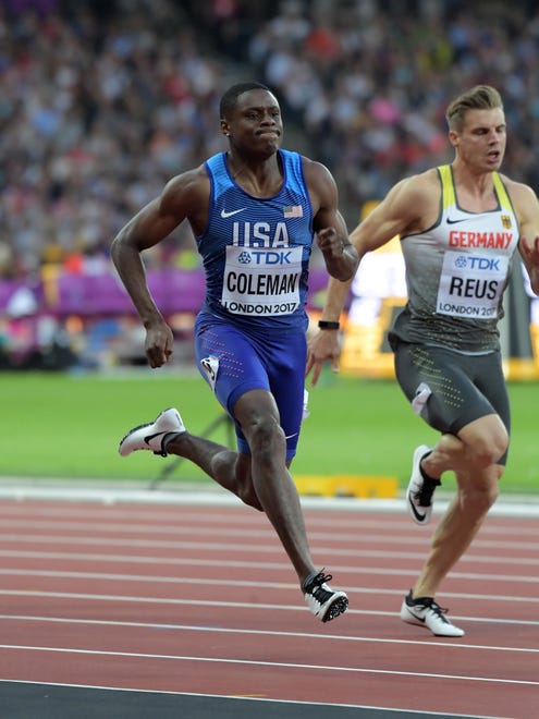 Christian Coleman of the USA wins his first-round heat in the 100.
