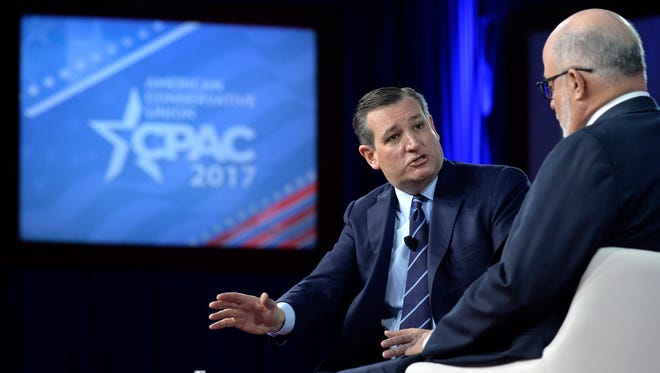 Cruz speaks with commentator Mark Levin during a discussion of the Constitution during the Conservative Political Action Conference at National Harbor, Md., on Feb. 23, 2017.