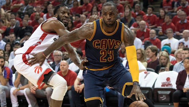 Cleveland Cavaliers forward LeBron James (23) drives to the basket as Toronto Raptors forward DeMarre Carroll (5) tries to defend during the third quarter of game six of the Eastern conference finals of the NBA Playoffs.
