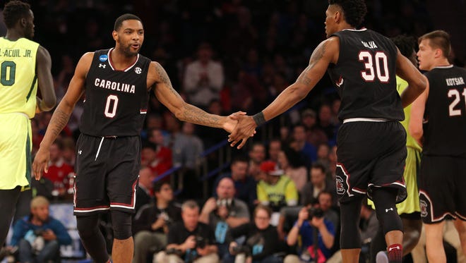 South Carolina Gamecocks guard Sindarius Thornwell (0) celebrates with forward Chris Silva (30) during the second half against the Baylor Bears in the semifinals of the East Regional of the 2017 NCAA Tournament at Madison Square Garden.