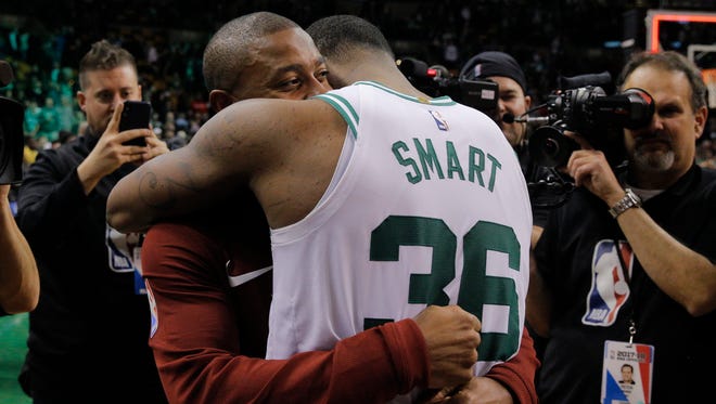 Jan. 3, 2018: Thomas hugs ex-teammate Marcus Smart after the Cavaliers' game against the Celtics.