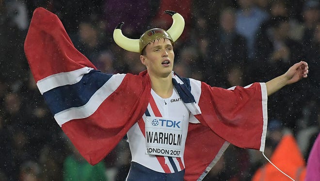 Norway's Karsten Warholm takes a victory lap after winning the 400-meter hurdles during the IAAF World Championships in Athletics at London Stadium at Queen Elizabeth Park.