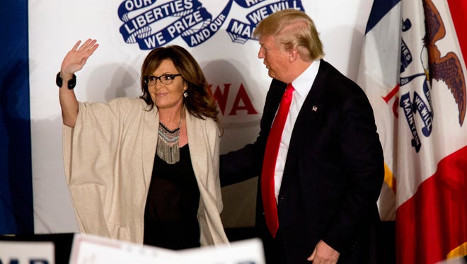 Donald Trump is joined on stage by Palin during a campaign event in Cedar Rapids, Iowa, on Feb. 1, 2016.