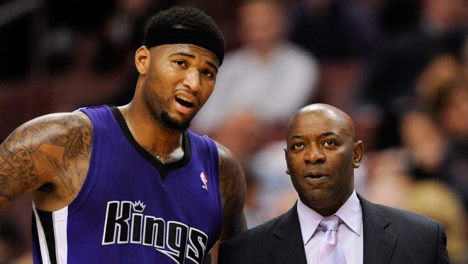 2012: Sacramento Kings head coach Keith Smart talks with center DeMarcus Cousins (15).