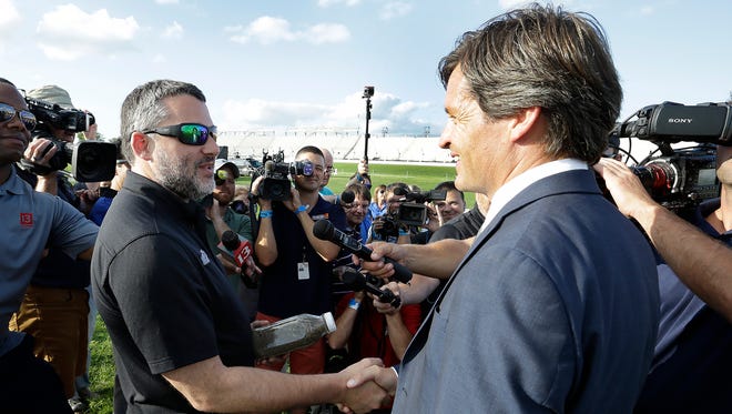 Tony Stewart talks to IMS president Doug Boles and the local media before doing a couple laps on the temporary 3/16th-mile oval made for him inside Turn 3 at Indianapolis Motor Speedway.