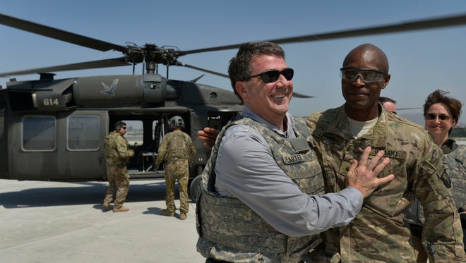 Deputy Secretary of Defense Ashton B. Carter, left, is welcomed by Brig. Gen. Ron Lewis at Jalalabad Air Base in the Nangarhar province of Afghanistan on May 13, 2013.