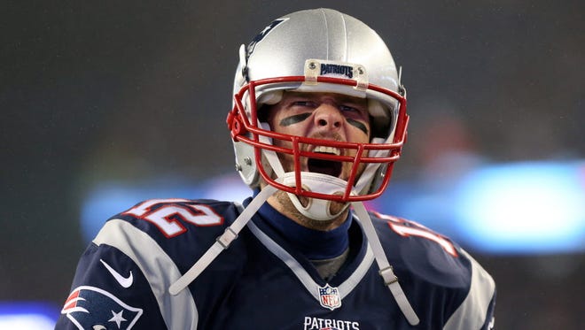 Patriots quarterback Tom Brady (12) gets ready for the game against the Steelers.