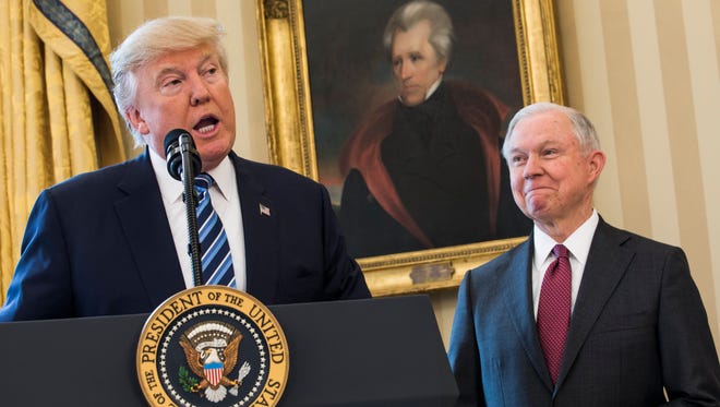 Attorney General Jeff Sessions listens as President Trump speaks in the Oval Office of the White House on Feb. 9, 2017.