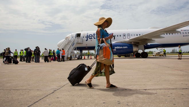 Passengers deplane from JetBlue flight 387, in Santa Clara, Cuba, Wednesday, Aug. 31, 2016 after traveling on the first commercial flight between the U.S. and Cuba in more than a half century.