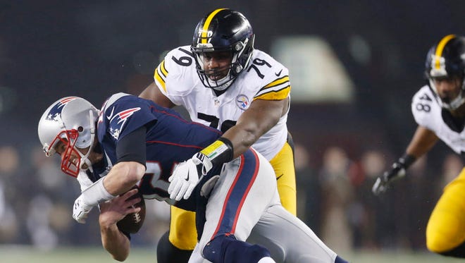 Patriots quarterback Tom Brady (12) is sacked by Steelers nose tackle Javon Hargrave (79) in the first quarter.