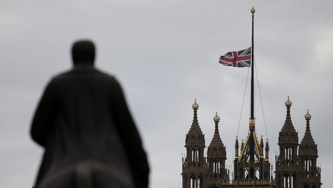 A Union flag flies at half-mast from a flagpole above the Houses of Parliament in London May 23, 2017, as a mark of respect to those killed and injured in the terror attack at the Ariana Grande concert at the Manchester Arena in Manchester on May 22. Twenty two people have been killed and dozens injured in Britain's deadliest terror attack in over a decade after a suspected suicide bomber targeted fans leaving a concert of US singer Ariana Grande.
