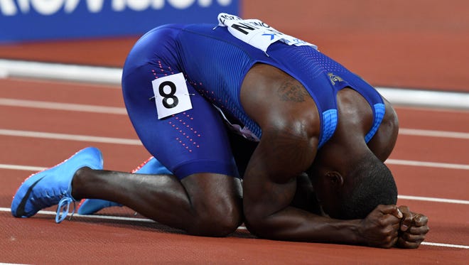 Justin Gatlin of the USA celebrates winning gold in the 100, 12 years after his first world championships gold.