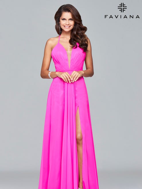 Many 2017 prom dresses feature bright colors like this "cherry pink" Faviana dress.