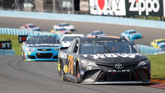 Martin Truex Jr., front, executed a perfect fuel-mileage strategy to win the I Love New York 355, Aug. 6 at Watkins Glen International.