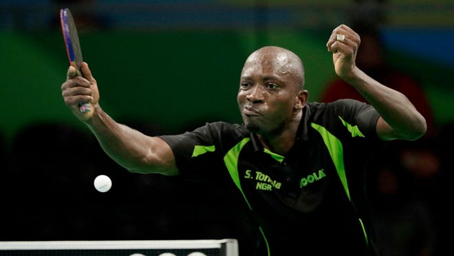 Segun Toriola (NGR) returns the ball to Dmitrij Prokopcov (CZE) during a round 1 table tennis match at Riocentro Pavilion 3 in the Rio 2016 Summer Olympic Games.