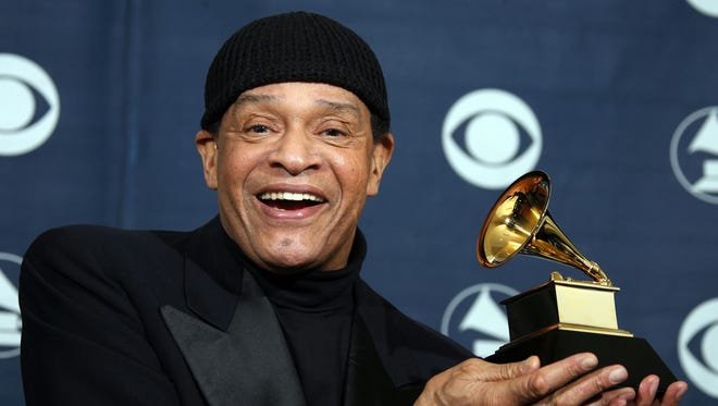 Singer Al Jarreau poses with his trophy at the 49th Grammy Awards in Los Angeles on Feb. 11, 2007.