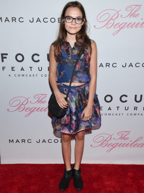 Actress Oona Laurence attended in a patterned skirt and matching top.