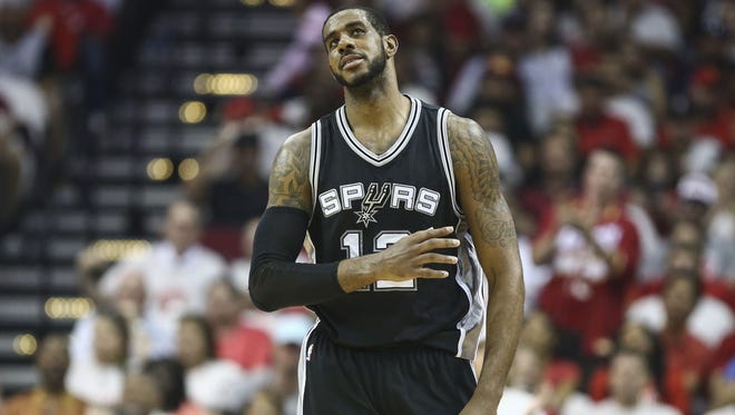 San Antonio Spurs forward LaMarcus Aldridge (12) reacts after a play during the second quarter against the Houston Rockets in game four of the second round of the 2017 NBA Playoffs at Toyota Center.