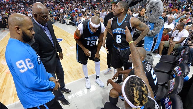 Coach Clyde Drexler of Power huddles with his team in their game against Killer 3s during week two of the BIG3 three on three basketball league at Spectrum Center on July 2, 2017 in Charlotte, North Carolina.