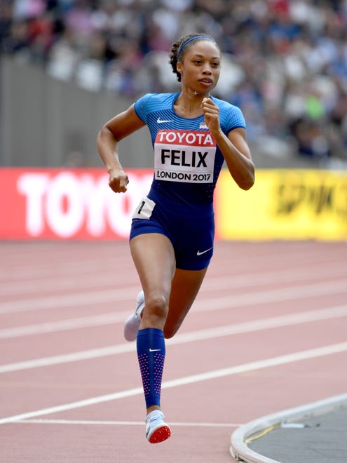 Allyson Felix of the USA wins her heat in Round 1 of the 400.