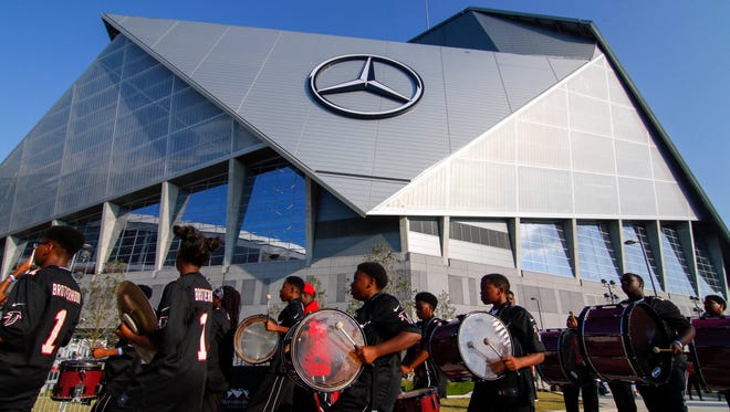 The Atlanta Falcons' drumline performs in front of Mercedes-Benz Stadium before a game against the Green Bay Packers.