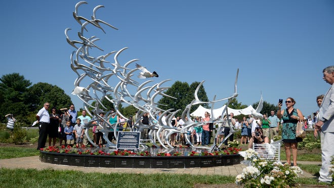 Homing pigeons are released during the memorial service for the 10th anniversary of Comair flight 5191 crash in Lexington on Saturday.
